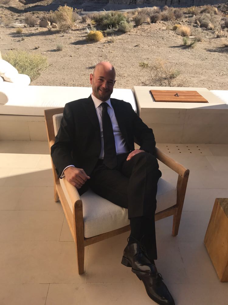 jason colodne of colbeck sitting in a chair on a gazebo