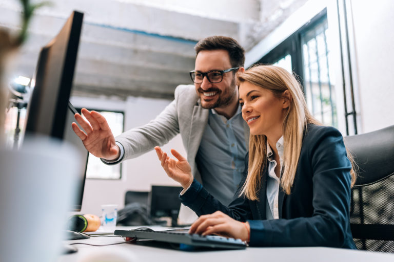 two business people create a disaster recovery plan at computer