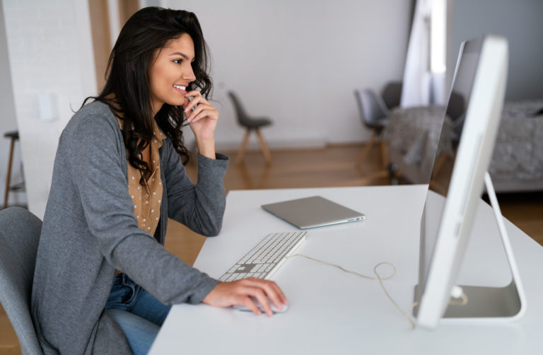 Woman using computer at desk